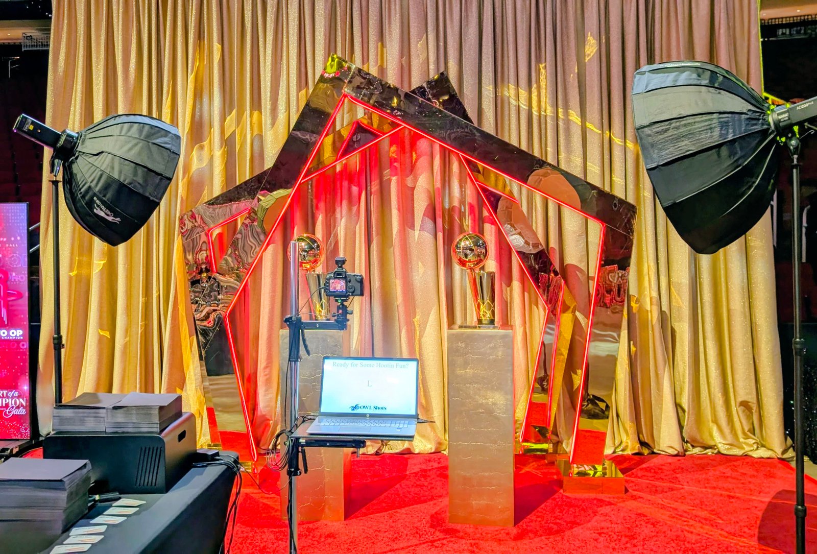 OWLShots studio portrait setup at a championship celebration, with trophy display and dramatic lighting
