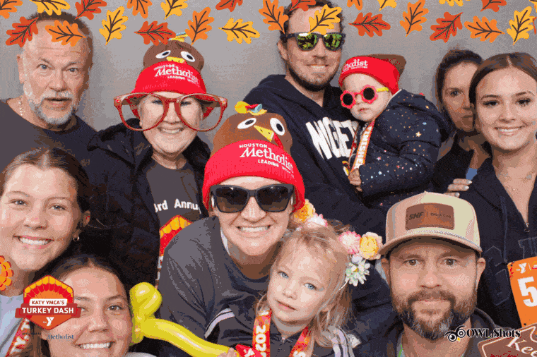 A family in Houston Methodist turkey beanies at the Katy YMCA's Turkey Dash
